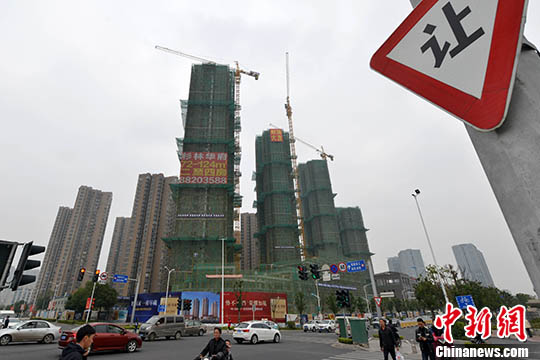 資料圖：福州一處商品房在建中。 <a target='_blank' href='http://www.chinanews.com/'>中新社</a>記者 呂明 攝